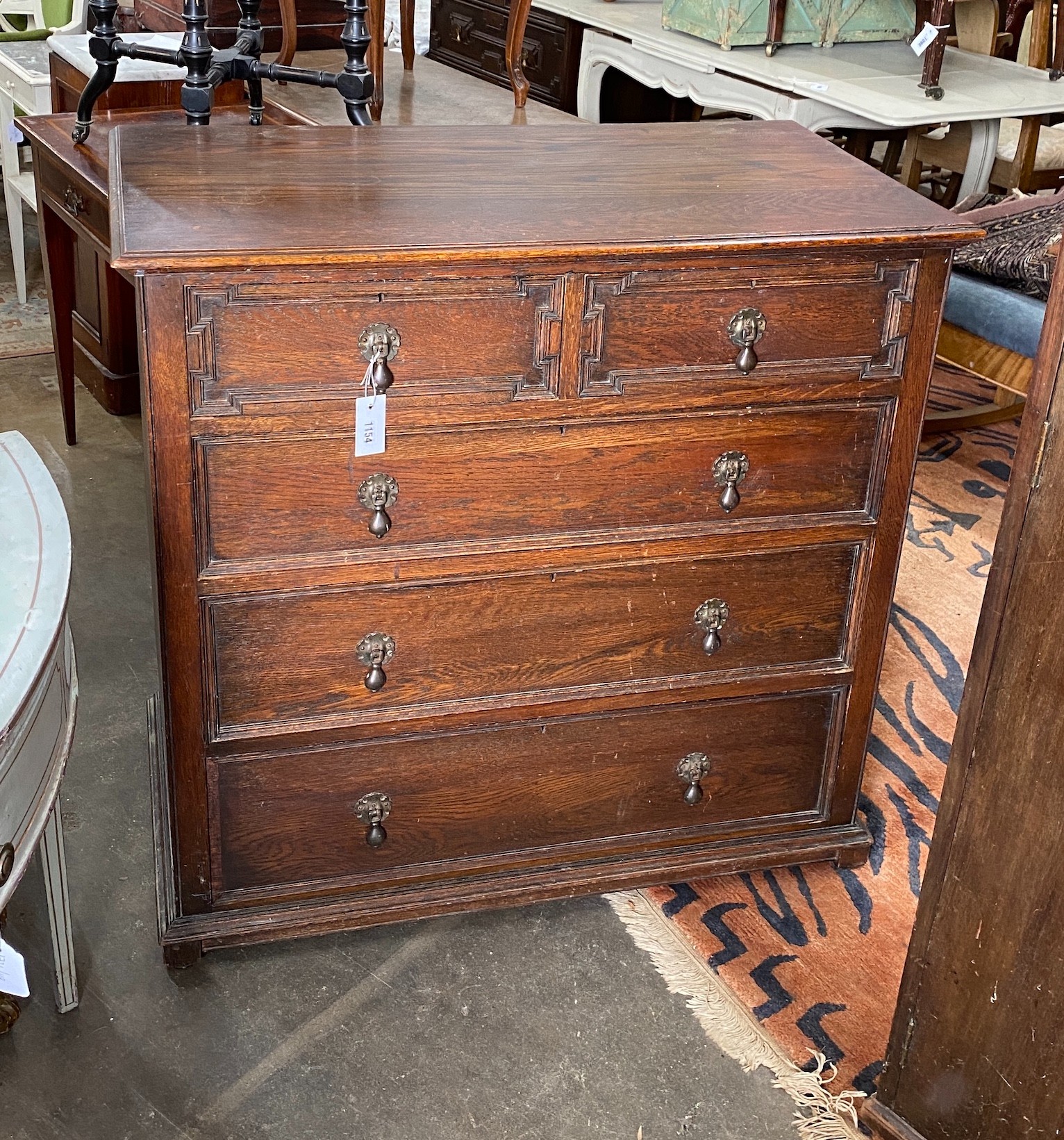 A 1920's Jacobean revival oak chest, width 99cm, depth 54cm, height 96cm
